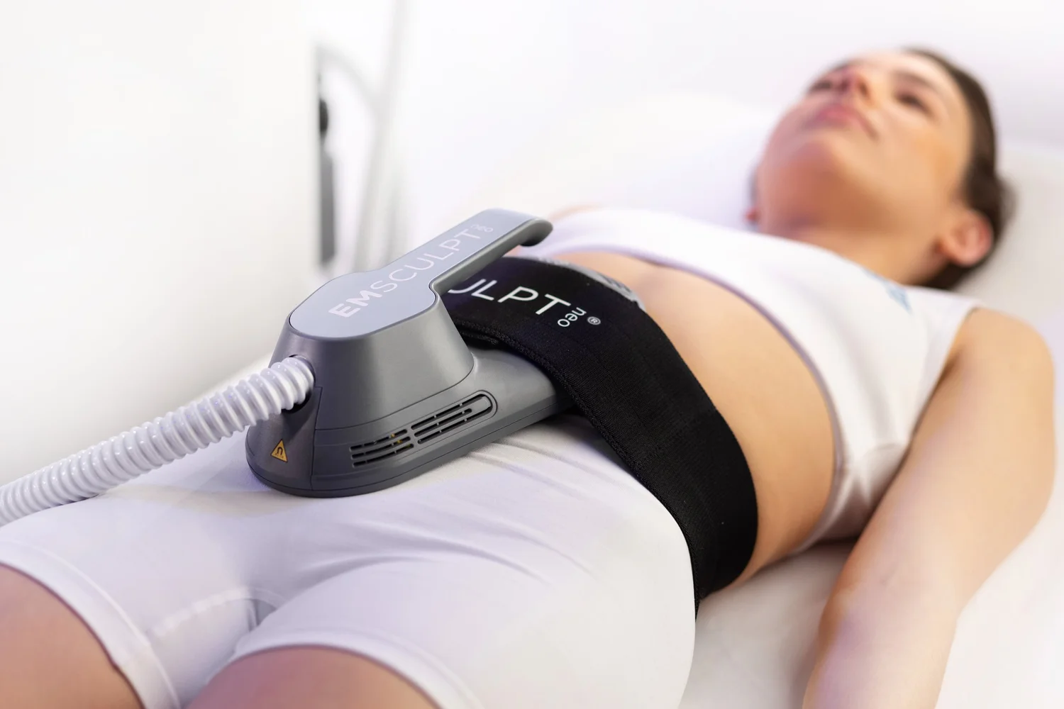 EMSCULPT NEO treatment session showing advanced body contouring technology