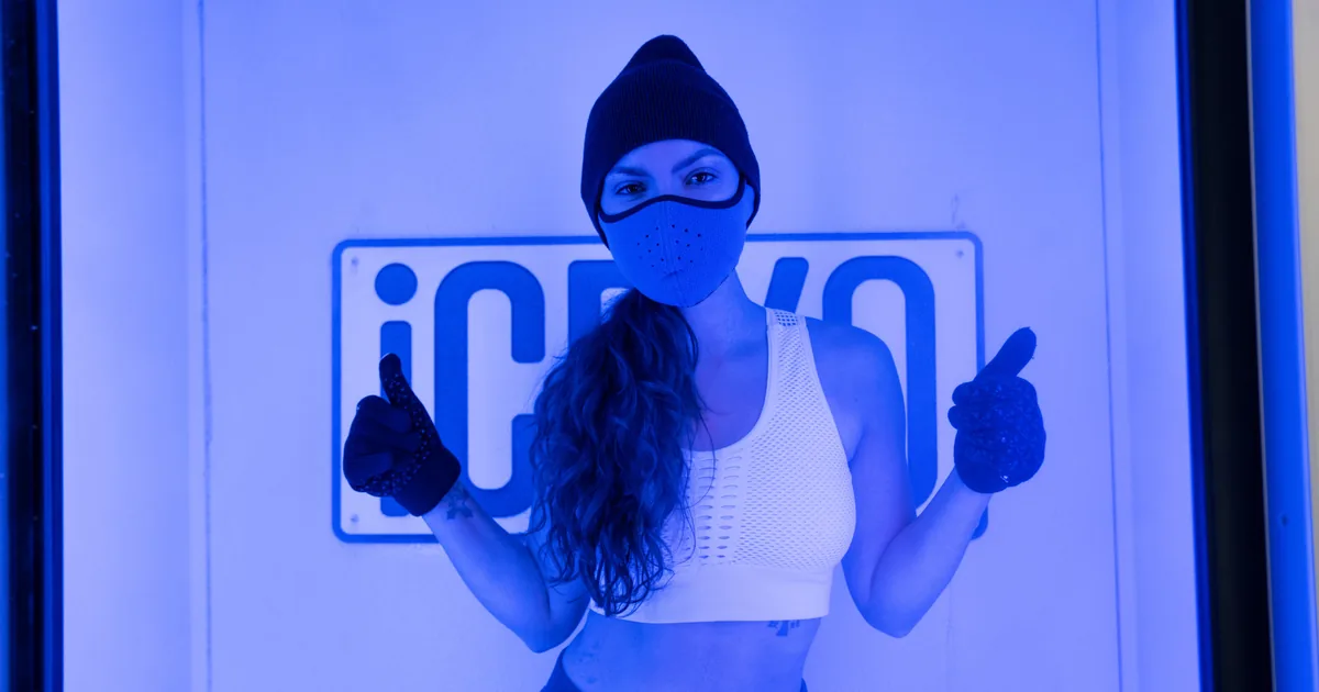 Energized client after a whole-body cryotherapy session at iCRYO Grosse Pointe