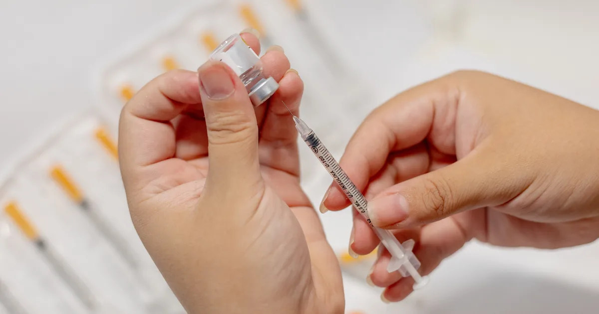 Provider reviewing a physician-supervised peptide protocol with a client at iCRYO Grosse Pointe