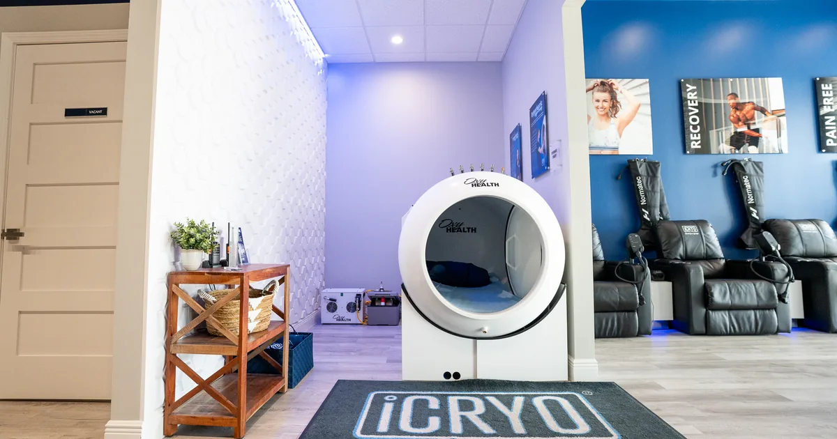 Client relaxing in a hyperbaric oxygen chamber at iCRYO Grosse Pointe, MI