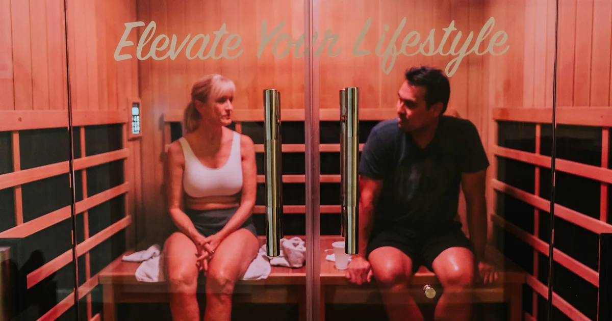 Woman relaxing in an infrared sauna at iCRYO Grosse Pointe, MI