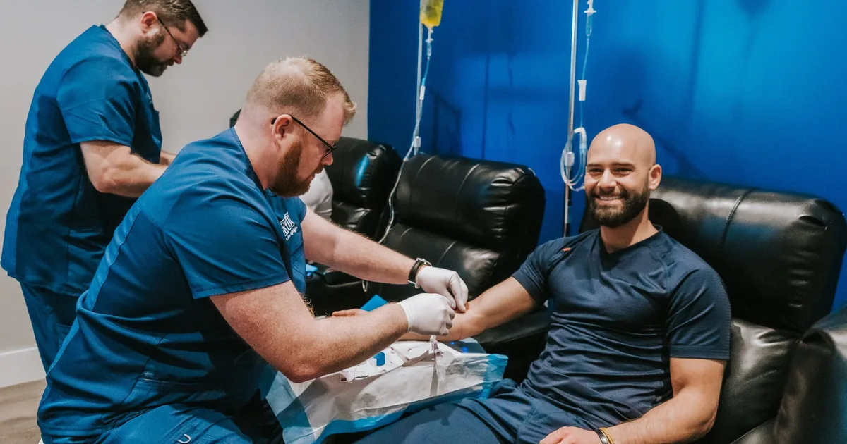 Client relaxing during an IV vitamin drip at iCRYO Grosse Pointe, MI
